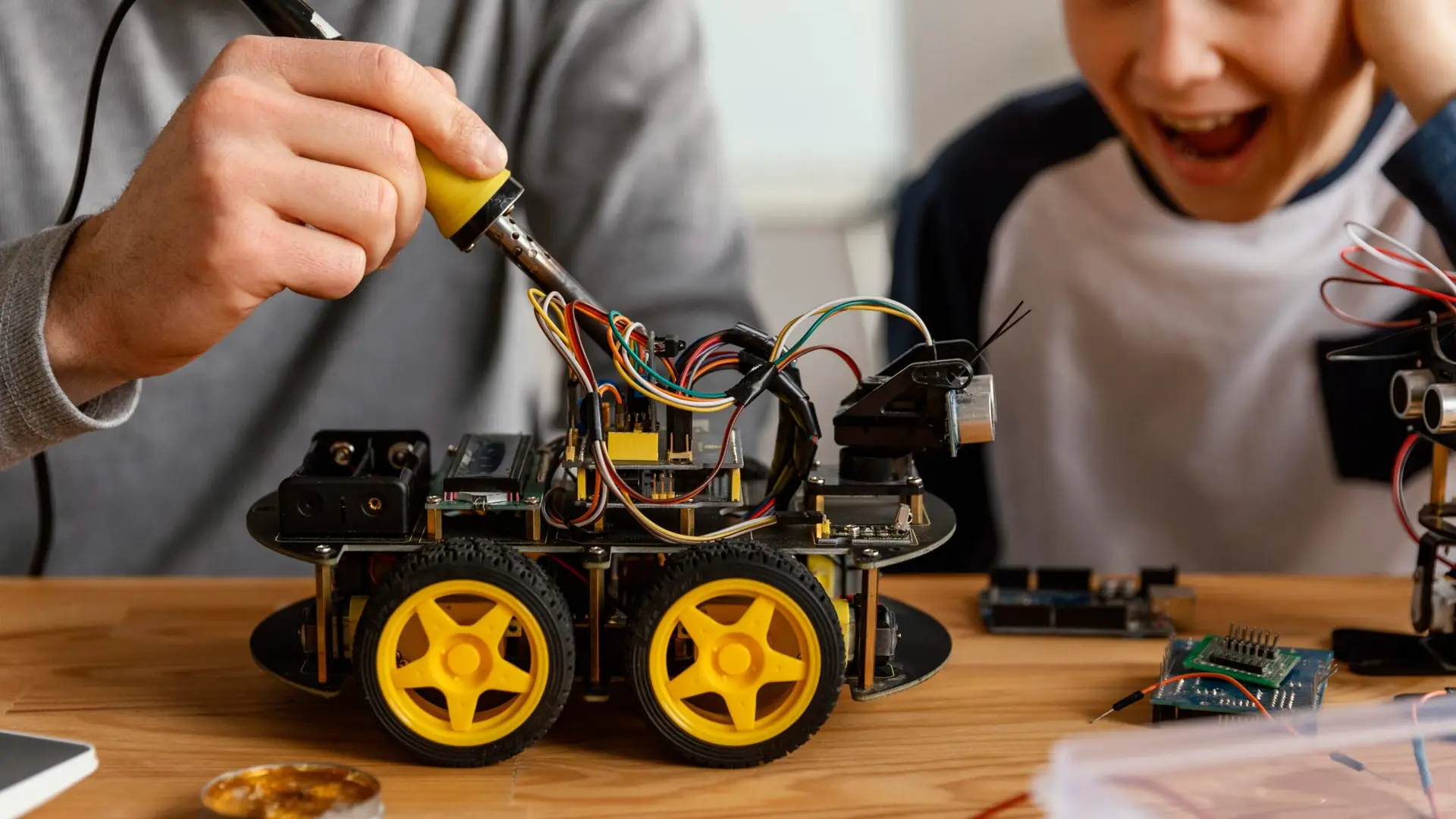 cropped-father-son-making-robot